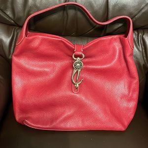 Dooney and Burke red hobo bag. No rips or stains. Buckle is broken